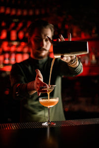 Bartender mixing Sobreo French Gentian non alcoholic cocktail and mocktail mixer in a non alcoholic drink